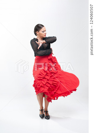 Spanish flamenco dancer in traditional dress isolated on white background for the April Fair 124060507