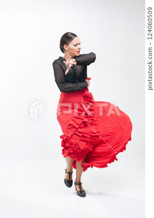 Spanish flamenco dancer in traditional dress isolated on white background for the April Fair 124060509