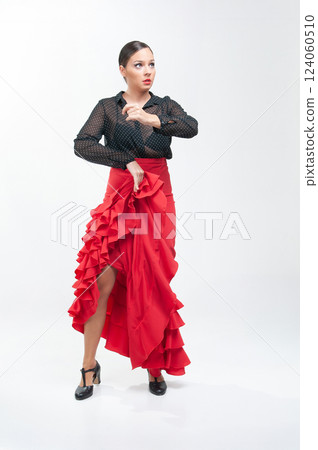 Spanish flamenco dancer in traditional dress isolated on white background for the April Fair 124060510