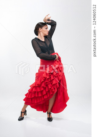 Spanish flamenco dancer in traditional dress isolated on white background for the April Fair 124060512