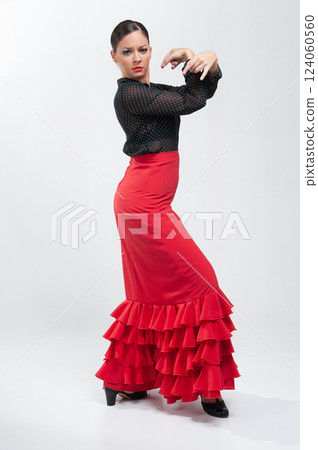 Spanish flamenco dancer in traditional dress isolated on white background for the April Fair Spanish flamenco dancer in traditional dress isolated on white background for the April Fair 124060560
