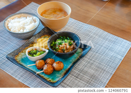 A Japanese breakfast of natto and yakitori is served on the table 124060791