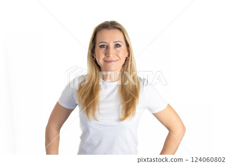 Portrait of young blond beautiful woman in jeans and white T-shirt look at camera pose for picture, pretty millennial blond female model with long hair isolated on white studio background 124060802