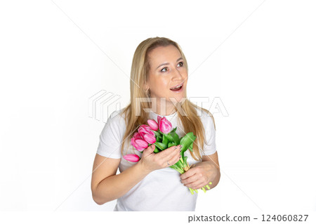 European blonde mature woman with Spring Flower Tulips pink bouquet. Happy surprised model woman smelling flowers. Mother's Day. Springtime European blonde mature woman with Spring Flower Tulips pink bouquet. Happy surprised model woman smelling flowers. Mother's Day. Springtime 124060827