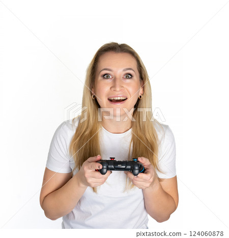 Photo of blond happy excited crazy smiling woman playing videogames addicted to playstation isolated on white background 124060878
