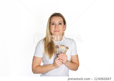Face makeup, beauty brush and happy woman with cosmetics tools, skincare wellness and facial transformation. Foundation application product, eye brush aesthetic studio person on pink background Face makeup, beauty brush and happy woman with cosmetics tools, skincare wellness and facial transformation. Foundation application product, eye brush aesthetic studio person on pink background 124060887