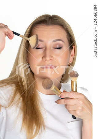 Face makeup, beauty brush and happy woman with cosmetics tools, skincare wellness and facial transformation. Foundation application product, eye brush aesthetic studio person on pink background 124060894