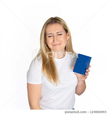 Sad angry blonde ukrainian woman in white t-shirt holding ukrainian passport isolated white background with sad face, negative down rejection concept Sad angry blonde ukrainian woman in white t-shirt holding ukrainian passport isolated white background with sad face, negative down rejection concept 124060943