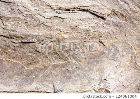rough texture of gray stone. natural rock background shot outside 124061004