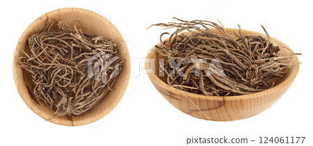 Dried Valerian root in wooden bowl isolated on white background. Valeriana officinalis with full depth of field. Top view Dried Valerian root in wooden bowl isolated on white background. Valeriana officinalis with full depth of field. Top view 124061177