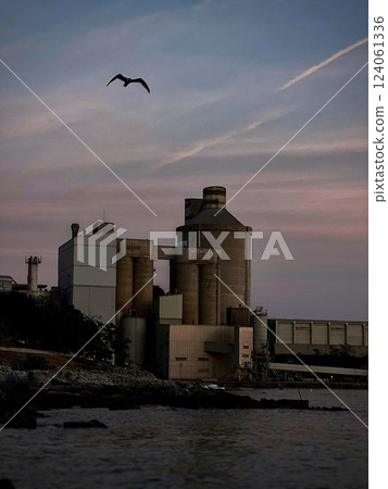 Sunset on the industrial coast 124061336