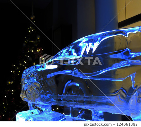 Souvenir Glass Vehicle In Front Of New Year Pine Tree  124061382