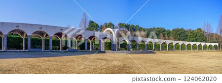 Panoramic view of a park with a winter corridor against a blue sky Panoramic view of a park with a winter corridor against a blue sky 124062020