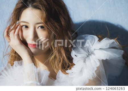Young woman wearing a tulle top Young woman wearing a tulle top 124063263