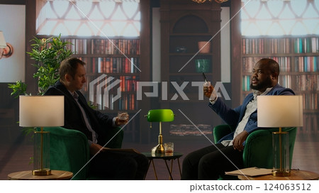 CIA specialists sharing insights and mission details on a hard drive, crack an encrypted hard disk in a private government safe house. Secure intelligence case of national safety. Camera A. 124063512