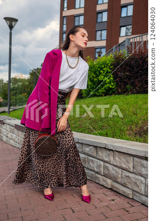 Portrait of Confident Woman in Urban Fashion. Bold Colors and Stylish Outfit 124064030