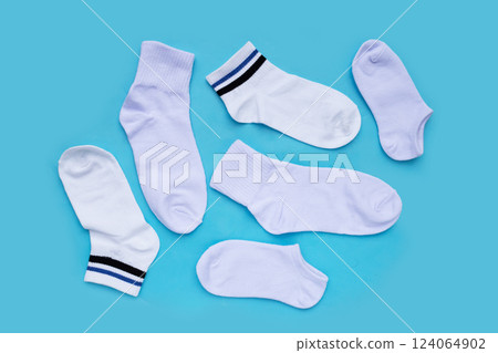 White socks on blue background. 124064902