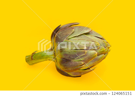 Fresh artichoke on yellow background. 124065151