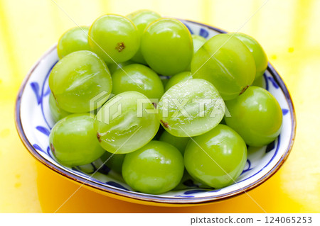 Shine muscat grape on yellow background. Shine muscat grape on yellow background. 124065253
