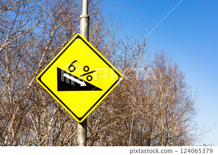 Scenery with a sign indicating a 6 degree downhill slope Scenery with a sign indicating a 6 degree downhill slope 124065379