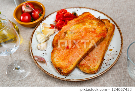 Sandwiches slices of bread smeared with olive oil and juice of fresh sweet and sour tomatoes 124067433