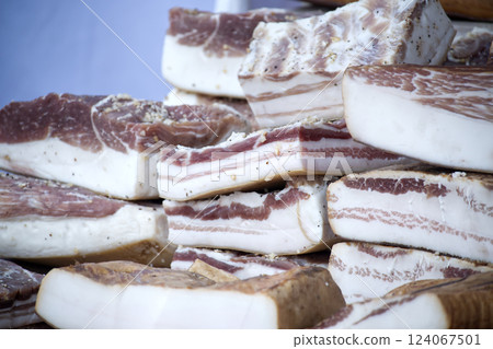 Flavorful display of meticulously cured pork belly, perfect for culinary enthusiasts and meat lovers 124067501