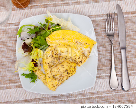 Omelet with salad of fresh lettuce for breakfast 124067594