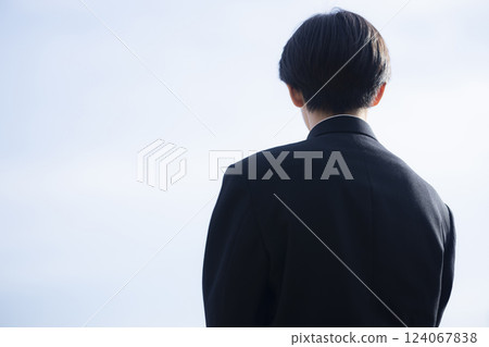 High school boy looking up at the sky 124067838