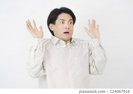 Man in his 20s, surprised, white background, facing right Man in his 20s, surprised, white background, facing right 124067916