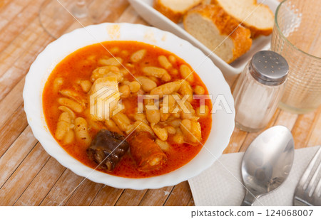 Tasty homemade stew of asturian beans with sausages. Spanish cuisine Tasty homemade stew of asturian beans with sausages. Spanish cuisine 124068007