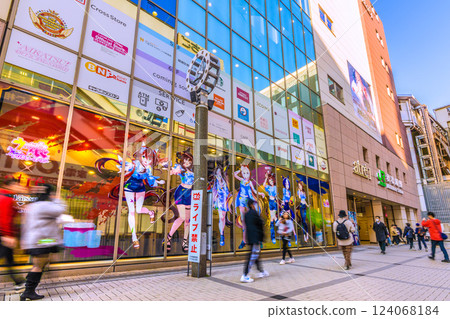 Tokyo cityscape, Japan. March. Akihabara is crowded with foreign tourists. Japanese people dressed in kimonos again... = 17th 124068184