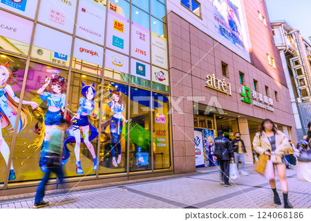 Tokyo cityscape, Japan. March. Akihabara is crowded with foreign tourists. Japanese people dressed in kimonos again... = 17th Tokyo cityscape, Japan. March. Akihabara is crowded with foreign tourists. Japanese people dressed in kimonos again... = 17th 124068186