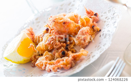 Chipirones, battered fried baby squid 124068226