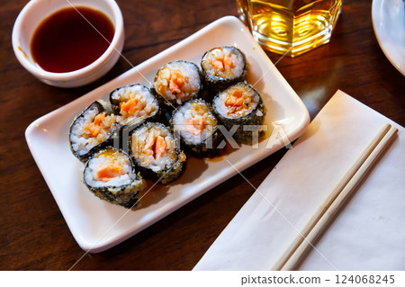 Fried maki rolls with salmon served soy sauce, japanese cuisine 124068245