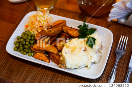 French style meat in Mornay sauce with vegetable garnish French style meat in Mornay sauce with vegetable garnish 124068250