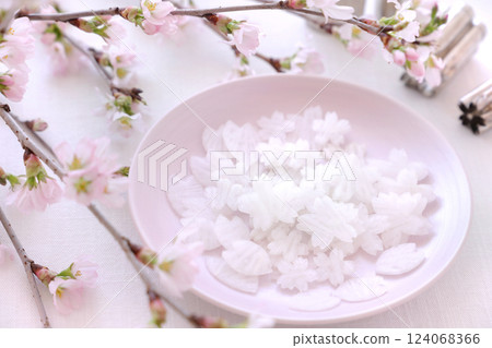 Sakura flower-shaped daikon radish as a decoration for chirashi sushi 124068366