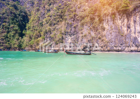 Long tail boat and speedboat at Pileh lagoon on Phi Phi island, Krabi, Thailand. landmark, destination Southeast Asia Travel, vacation and holiday concept 124069243