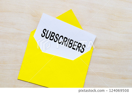 Subscribers text on white notepad inside a yellow envelope. Making money online concept. 124069508