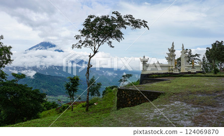 Ancient gate at Pura Penataran Agung Lempuyang temple and volcano Agung on Bali, Indonesia in cloudy day 124069870
