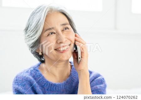 Senior woman talking on smartphone Senior woman talking on smartphone 124070262
