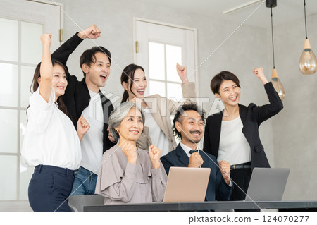 Career woman and businessman doing fist pump 124070277