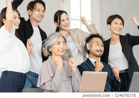 Career woman and businessman doing fist pump Career woman and businessman doing fist pump 124070278