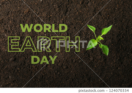 Earth Day, green sprout and text on black soil background, top view 124070334
