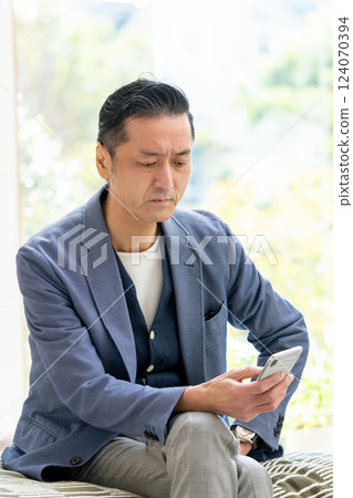 Male man manipulating smartphone Male man manipulating smartphone 124070394