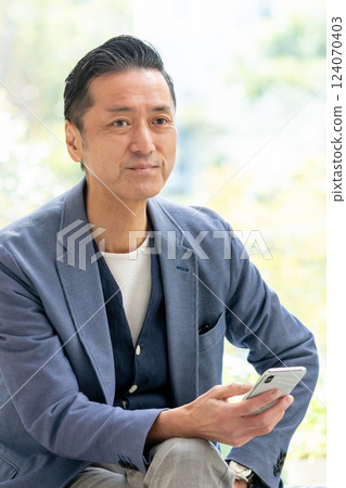 Male man manipulating smartphone 124070403