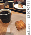 Coffee and scones at a cafe 124070724