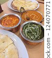 Three types of Indian curry and naan 124070771