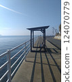 Seaside walkway and benches 124070779