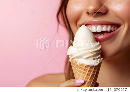 Smiling woman holding ice cream cone 124070957