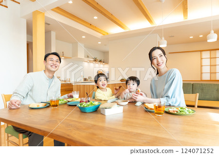 Young family eating at the table Young family eating at the table 124071252